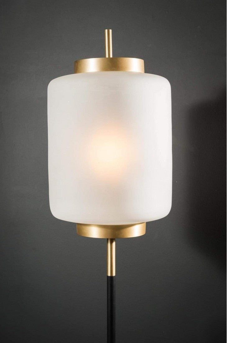 White Whisper floor lamp with a glowing white glass shade and brushed gold accents