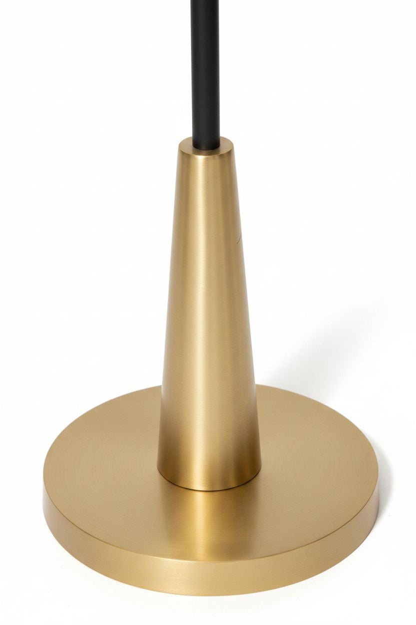 White Whisper floor lamp with a black stem and brushed gold circular base